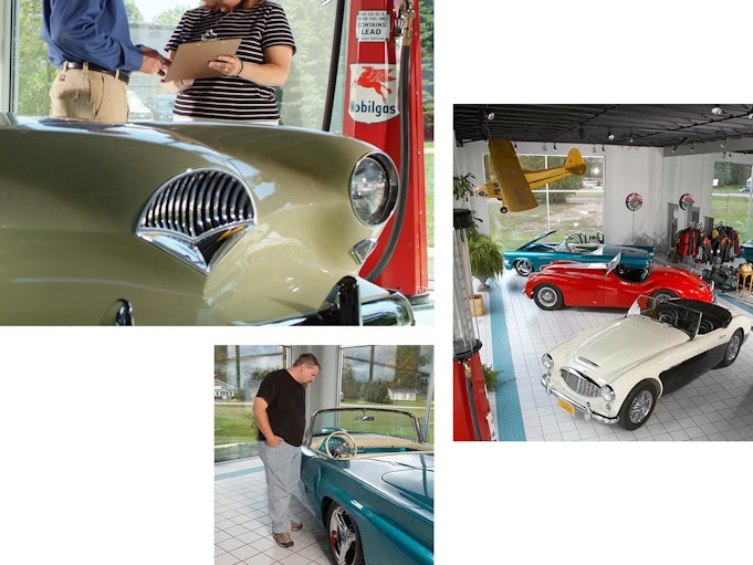 Collector vehicles on display at a dealership with a man giving a woman guidance on her purchase.