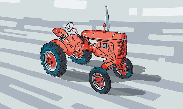 A light red antique style tractor