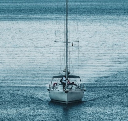 A sailboat on a calm body of water