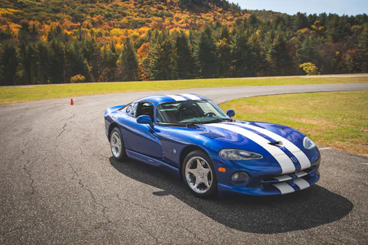 blue viper driving on a rural road