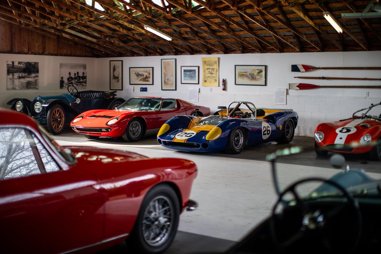 Classic and Collector cars Amelia Touring series in a garage.