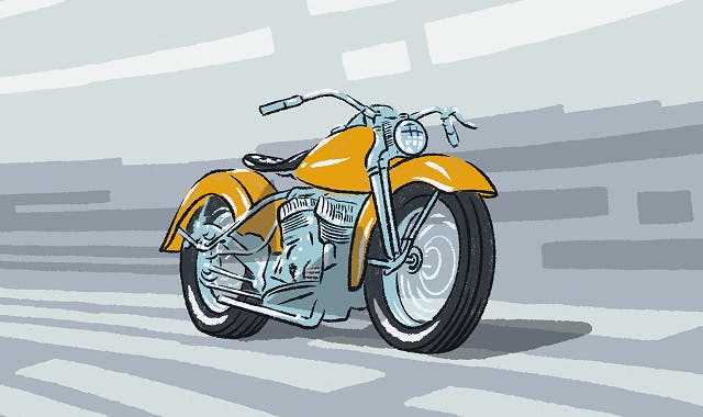 An orange chopper style motorcycle