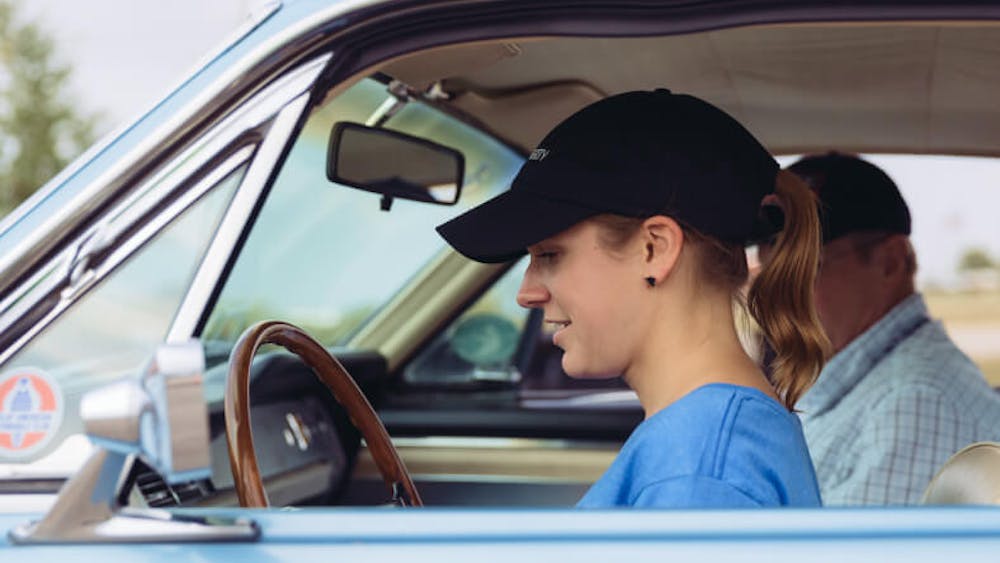 Young driver getting a driving lesson
