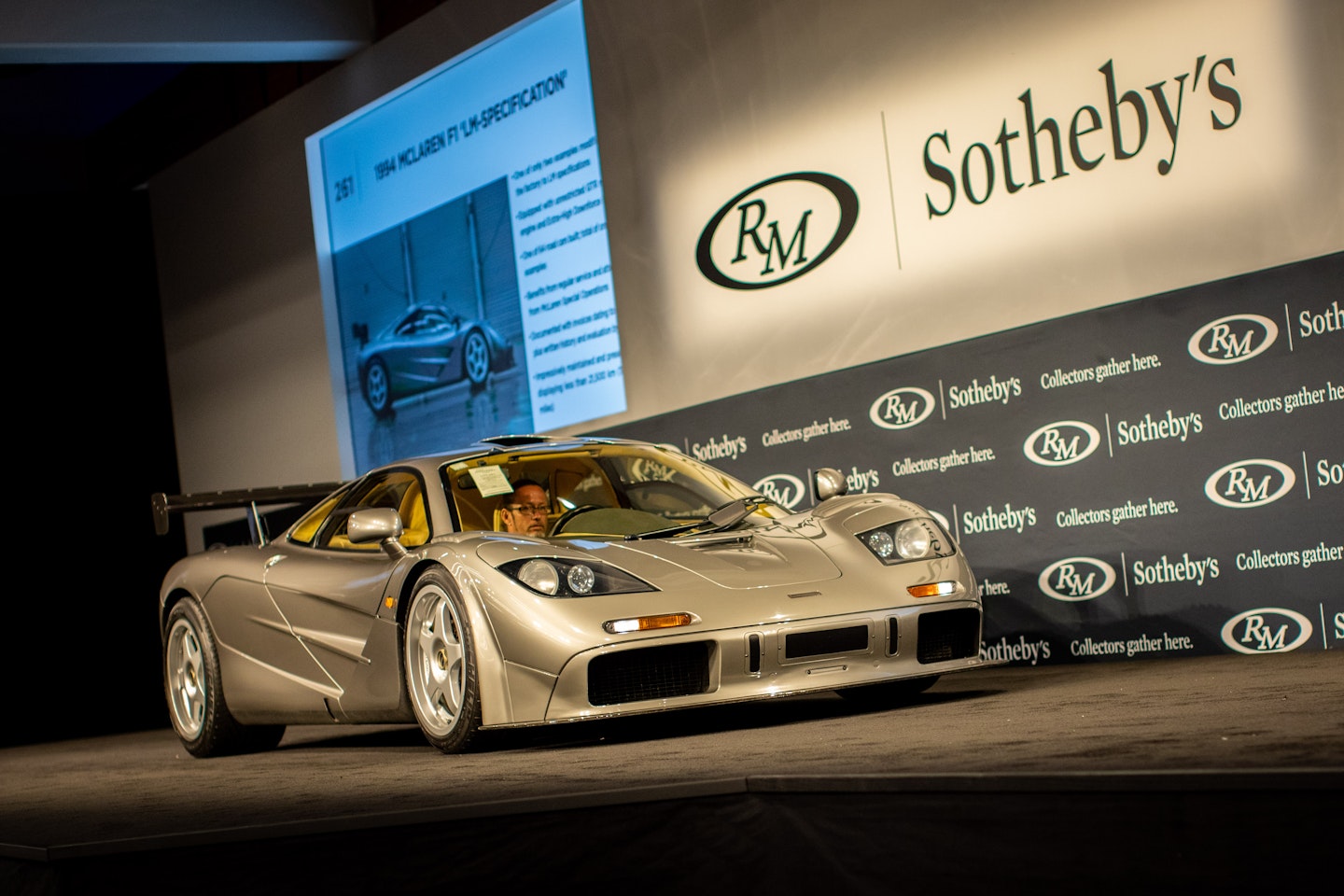 grey classic car on stage for selling at Sothebys auction