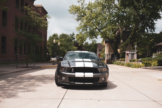 A black mustang with white stripes