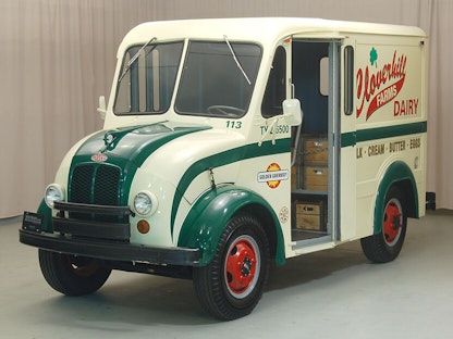 A white and green collector milk truck.