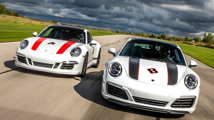 2 white Porsches on a track