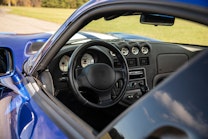 The dashboard of a blue Dodge Viper.