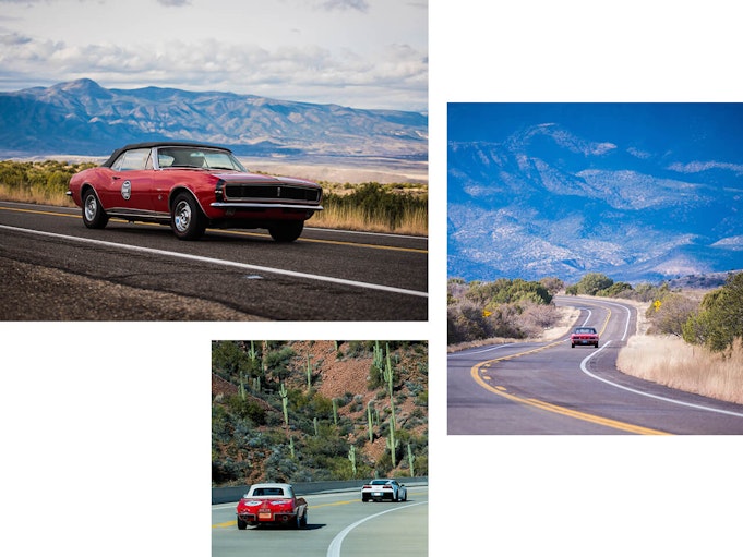 Collector vehicles driving out on an open road with mountains in the background and cacti off in the distance.