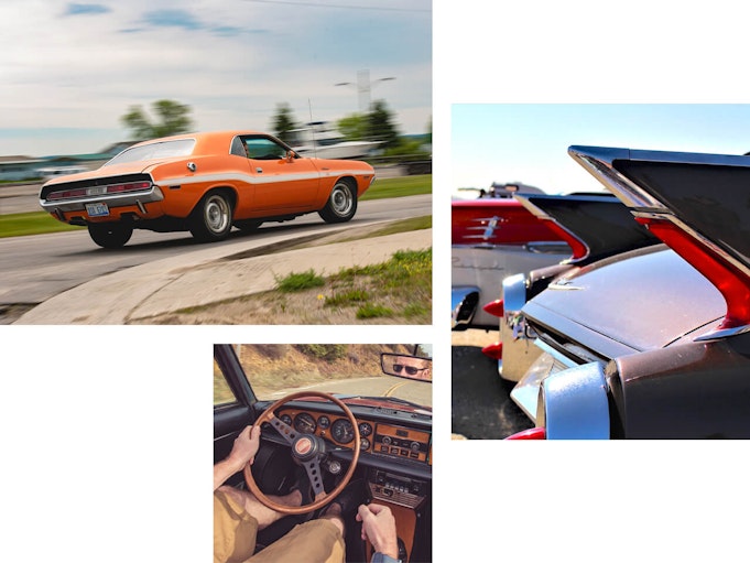 An orange collector vehicle driving down an open road. Back of a classic car. Image from passenger seat looking at person sitting in drivers seat holding steering wheel of classic car.