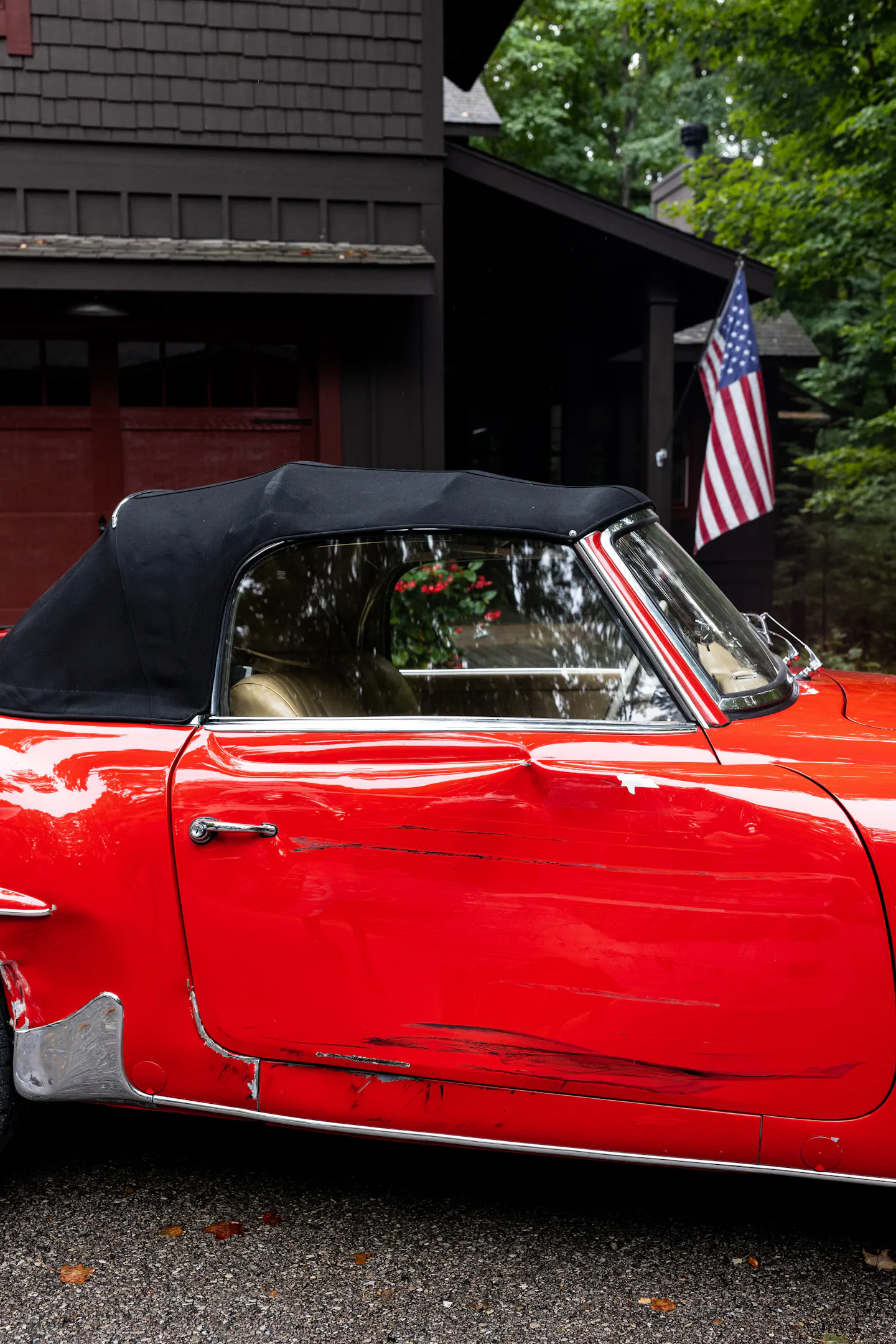 Red car with damage, claim, dent, after accident