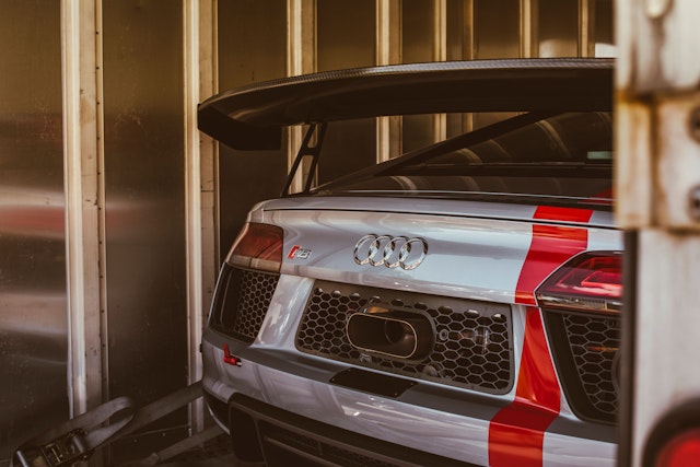 A vintage Audi parked in storage